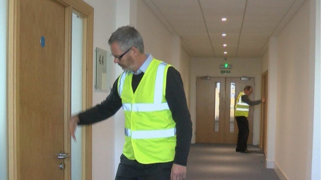 City fire training staff carrying out fire door survey